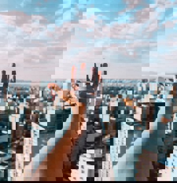 Hand above buildings