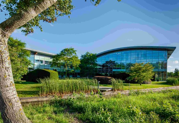 Priva Campus head quarters in the Netherlands, modern glass buildings and green landscape, main office of Priva.